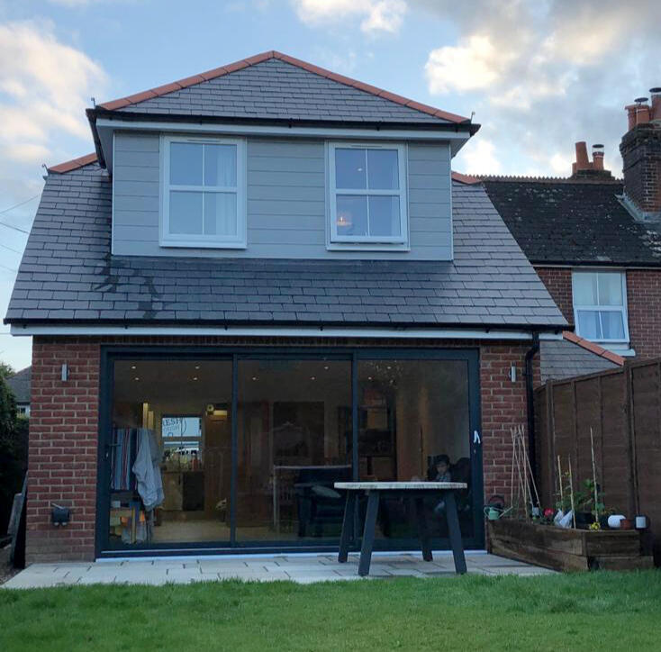 Open plan living extension, with sliding doors Open plan living extension, with sliding doors